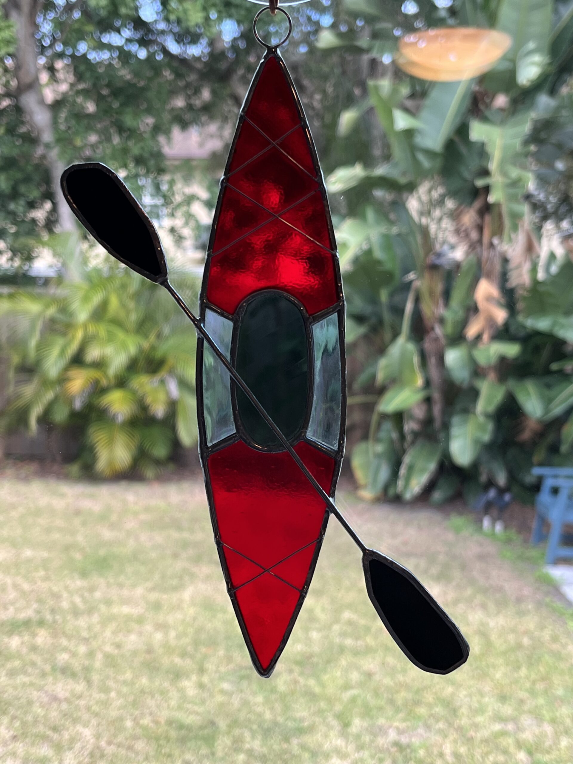 Stained glass red and blue kayak suncatcher