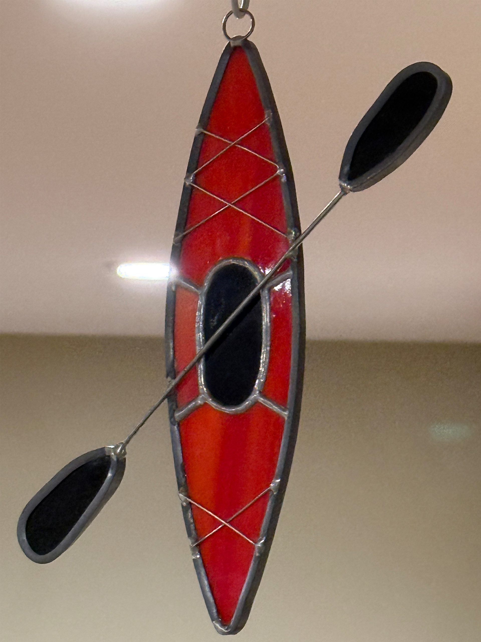 red kayak suncatcher